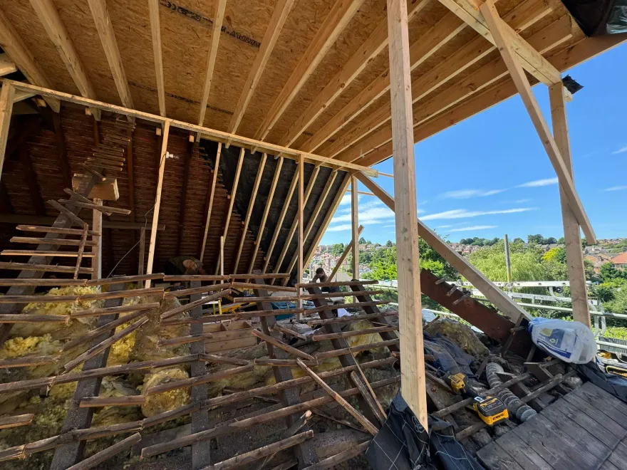 Loft roof opened up with new timber rafters and joists in place during the structural stage